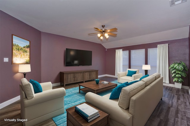 living room with lofted ceiling, ceiling fan, and dark wood-type flooring