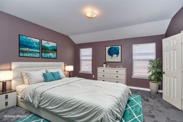 carpeted bedroom with lofted ceiling