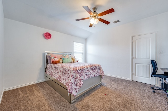 bedroom with ceiling fan, lofted ceiling, and carpet