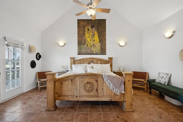 bedroom featuring ceiling fan, dark tile patterned floors, and vaulted ceiling