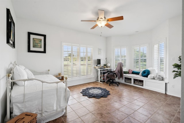 tiled bedroom with multiple windows and ceiling fan