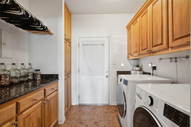 laundry area with cabinets, light tile patterned flooring, and washer and dryer