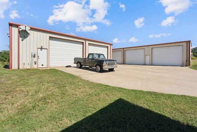 garage featuring a lawn