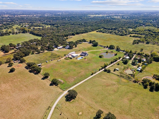 birds eye view of property with a water view and a rural view