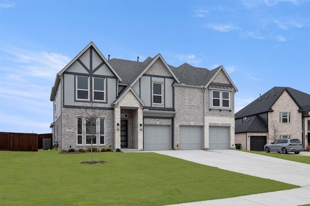 view of front of property featuring concrete driveway, central AC unit, a front yard, fence, and a garage