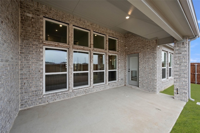 view of patio / terrace featuring fence