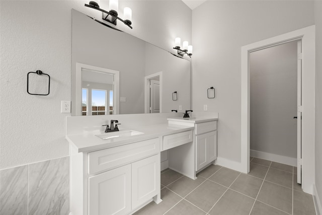 bathroom with vanity and tile patterned flooring