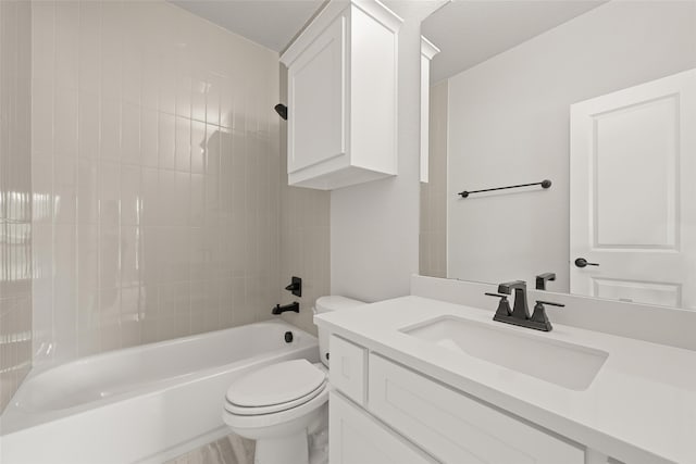 full bathroom with vanity, toilet, hardwood / wood-style floors, and shower / bathing tub combination