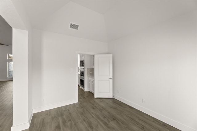 empty room with dark wood-type flooring