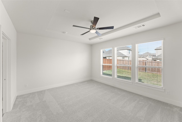 spare room with light carpet and ceiling fan