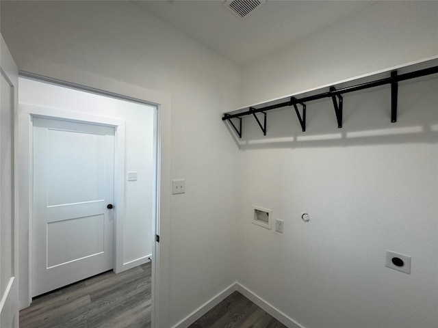 laundry area featuring hardwood / wood-style flooring, washer hookup, hookup for a gas dryer, and hookup for an electric dryer