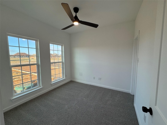 carpeted empty room featuring ceiling fan