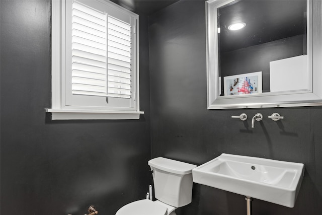 bathroom with sink and toilet