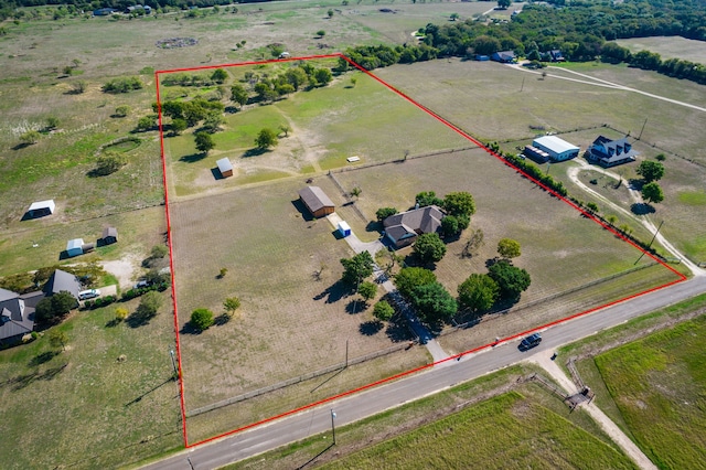 birds eye view of property featuring a rural view