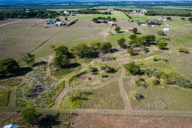 birds eye view of property featuring a rural view