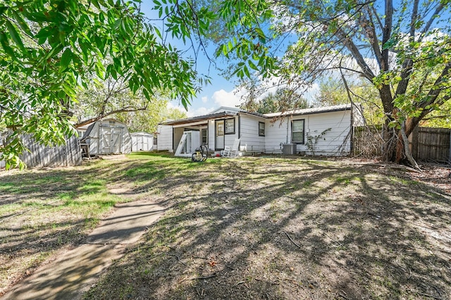 exterior space with a storage shed and central air condition unit