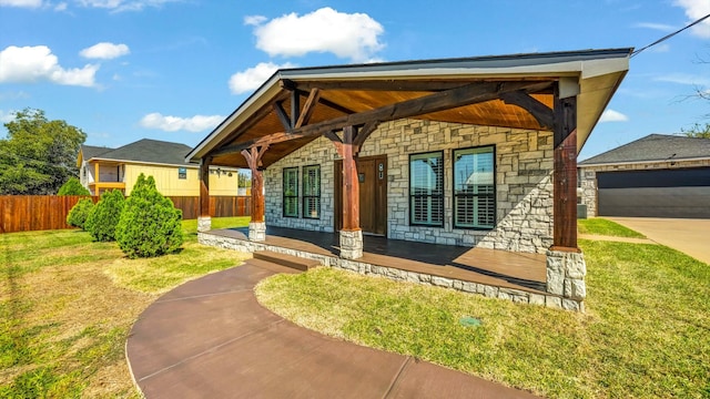 114 Mulberry, Possum Kingdom Lake, TX 76449 - view of front of house featuring stone siding, covered porch, and a garage