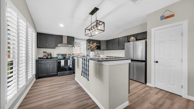 kitchen featuring range with electric stovetop, baseboards, light wood-style floors, wall chimney range hood, and freestanding refrigerator