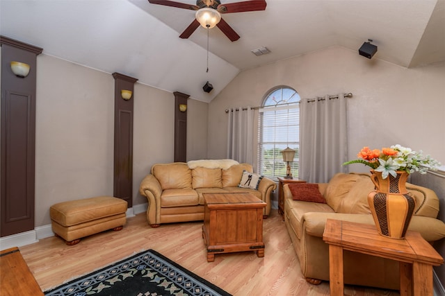 living room with light hardwood / wood-style floors, lofted ceiling, and ceiling fan