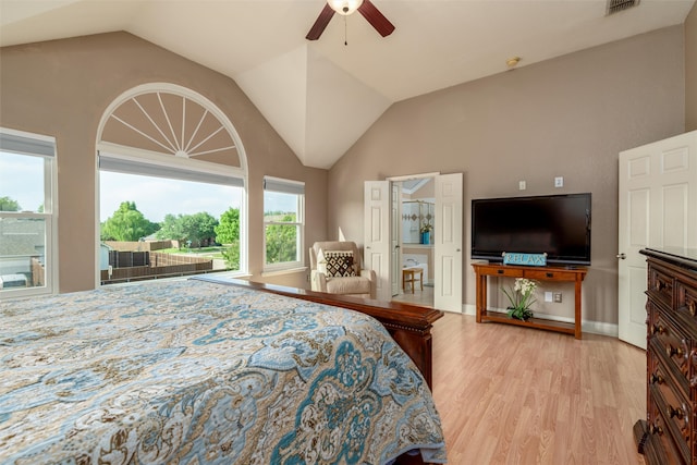 bedroom with lofted ceiling, light hardwood / wood-style floors, and ceiling fan