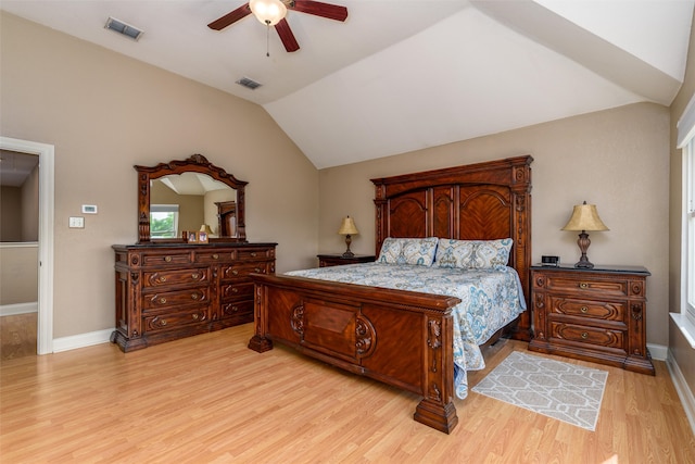 bedroom with light hardwood / wood-style floors, ceiling fan, and vaulted ceiling