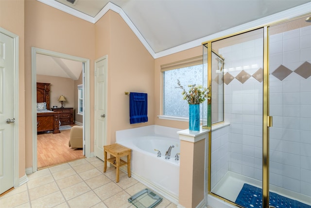 bathroom with shower with separate bathtub, lofted ceiling, ornamental molding, and hardwood / wood-style flooring