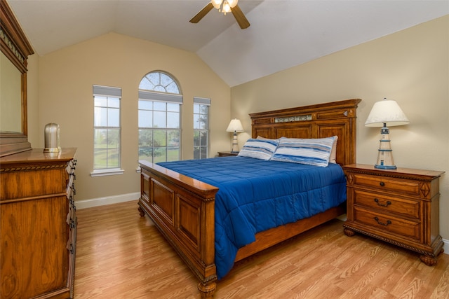 bedroom with lofted ceiling, light hardwood / wood-style floors, and ceiling fan