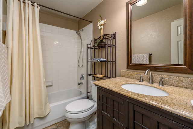 full bathroom featuring vanity, shower / tub combo, toilet, and a textured ceiling