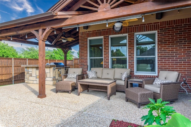 view of patio featuring ceiling fan, area for grilling, and outdoor lounge area