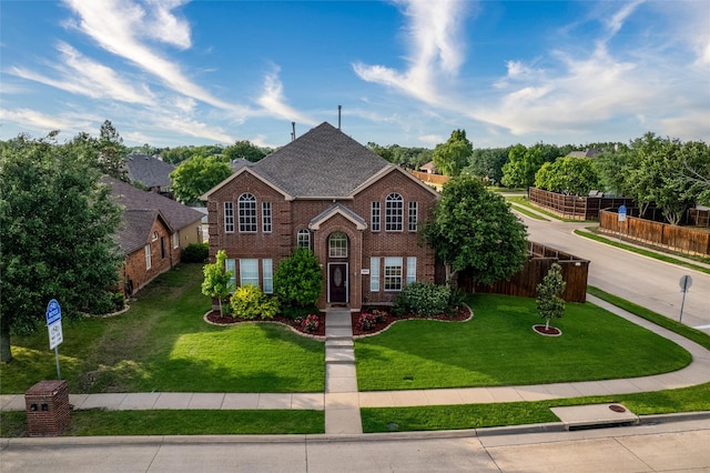 front facade with a front lawn