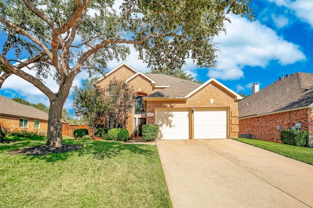 front facade featuring a garage and a front lawn