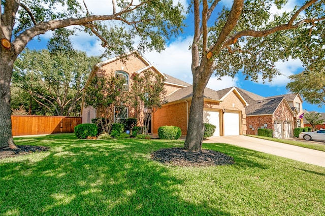 view of front of house featuring a garage and a front lawn