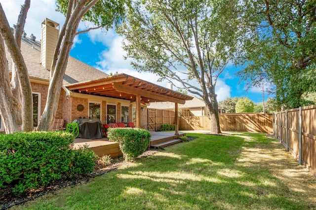 view of yard with a pergola and a deck