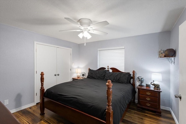bedroom with a closet, baseboards, a ceiling fan, and wood finished floors