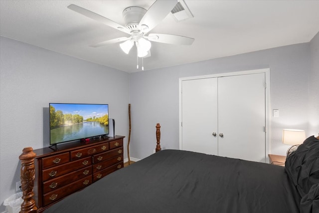 bedroom with ceiling fan and a closet