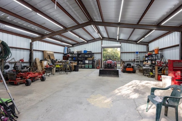 garage featuring metal wall and a workshop area