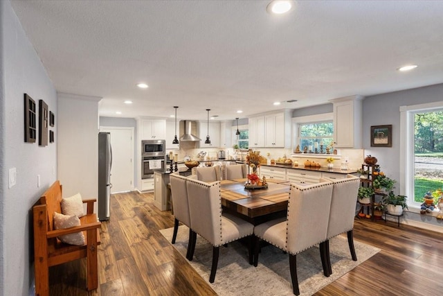 dining space featuring recessed lighting and dark wood finished floors