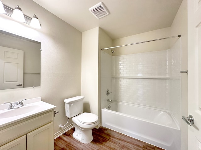 full bathroom featuring wood-type flooring, shower / bathing tub combination, vanity, and toilet