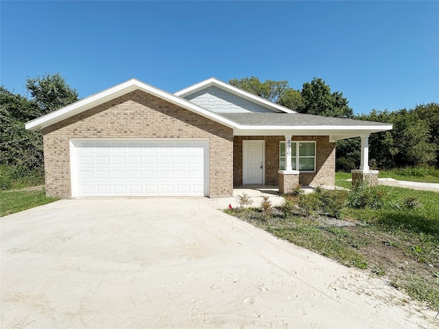 view of front of house featuring a garage and covered porch