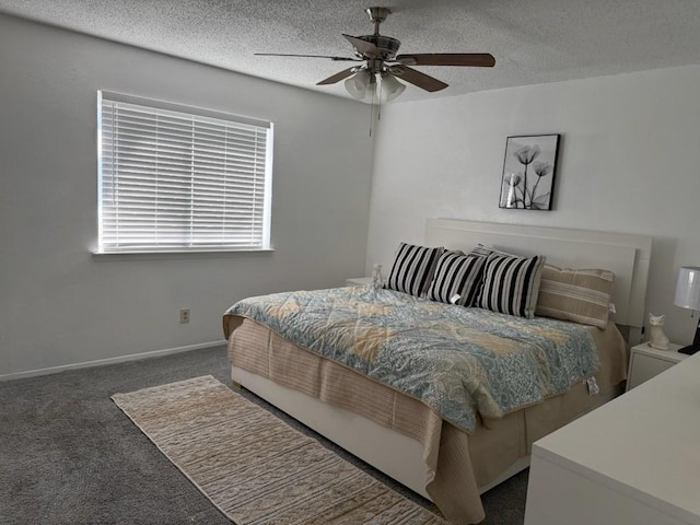 carpeted bedroom featuring a textured ceiling and ceiling fan