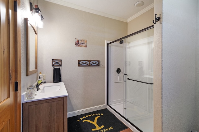 bathroom with walk in shower, vanity, and crown molding