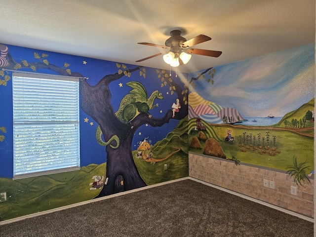 unfurnished bedroom with ceiling fan, carpet floors, a textured ceiling, and multiple windows