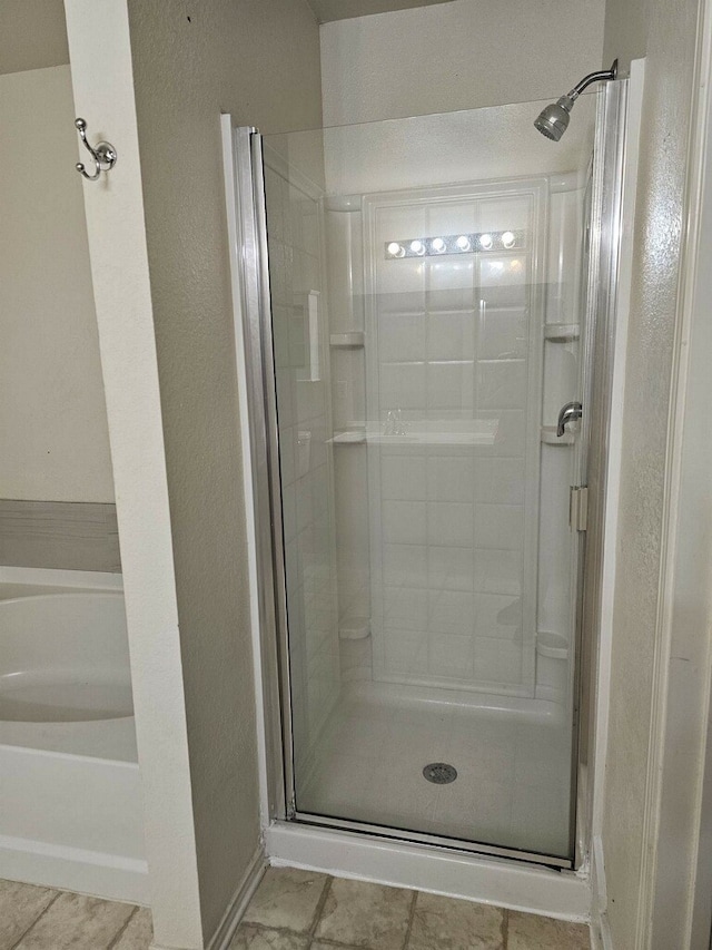 bathroom with independent shower and bath