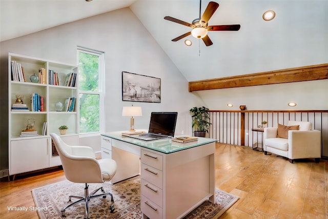 office space with ceiling fan, high vaulted ceiling, and light hardwood / wood-style flooring