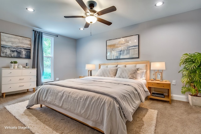 carpeted bedroom featuring ceiling fan