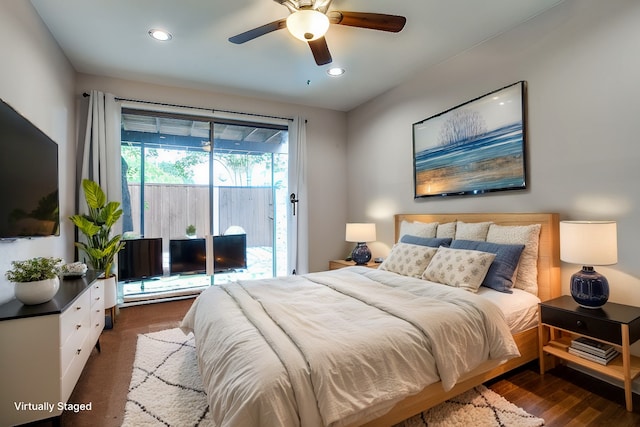 bedroom featuring access to exterior, dark wood-type flooring, and ceiling fan