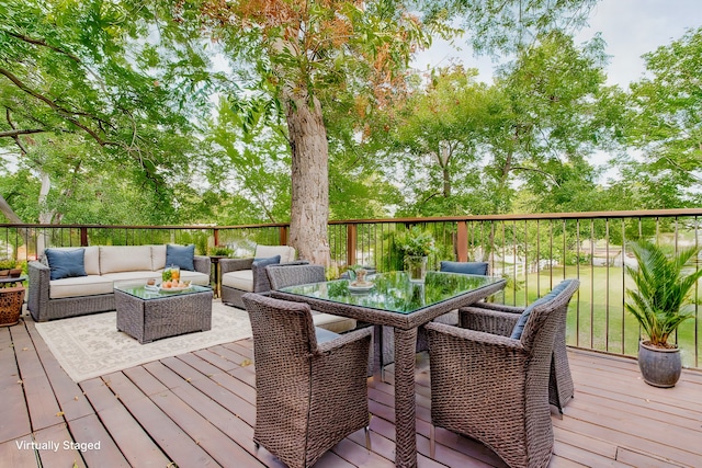 wooden terrace with an outdoor hangout area