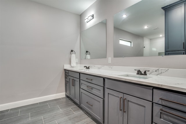 bathroom featuring vanity and a shower