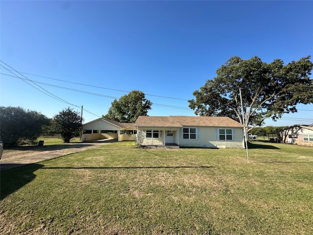 exterior space with a carport, driveway, and a front yard