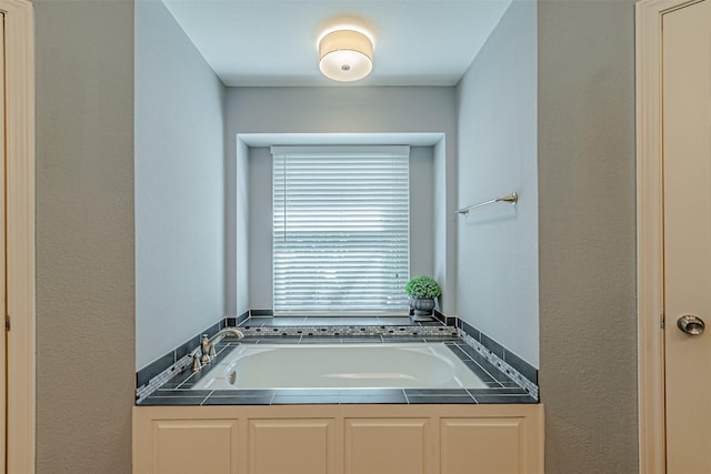 bathroom featuring a tub to relax in